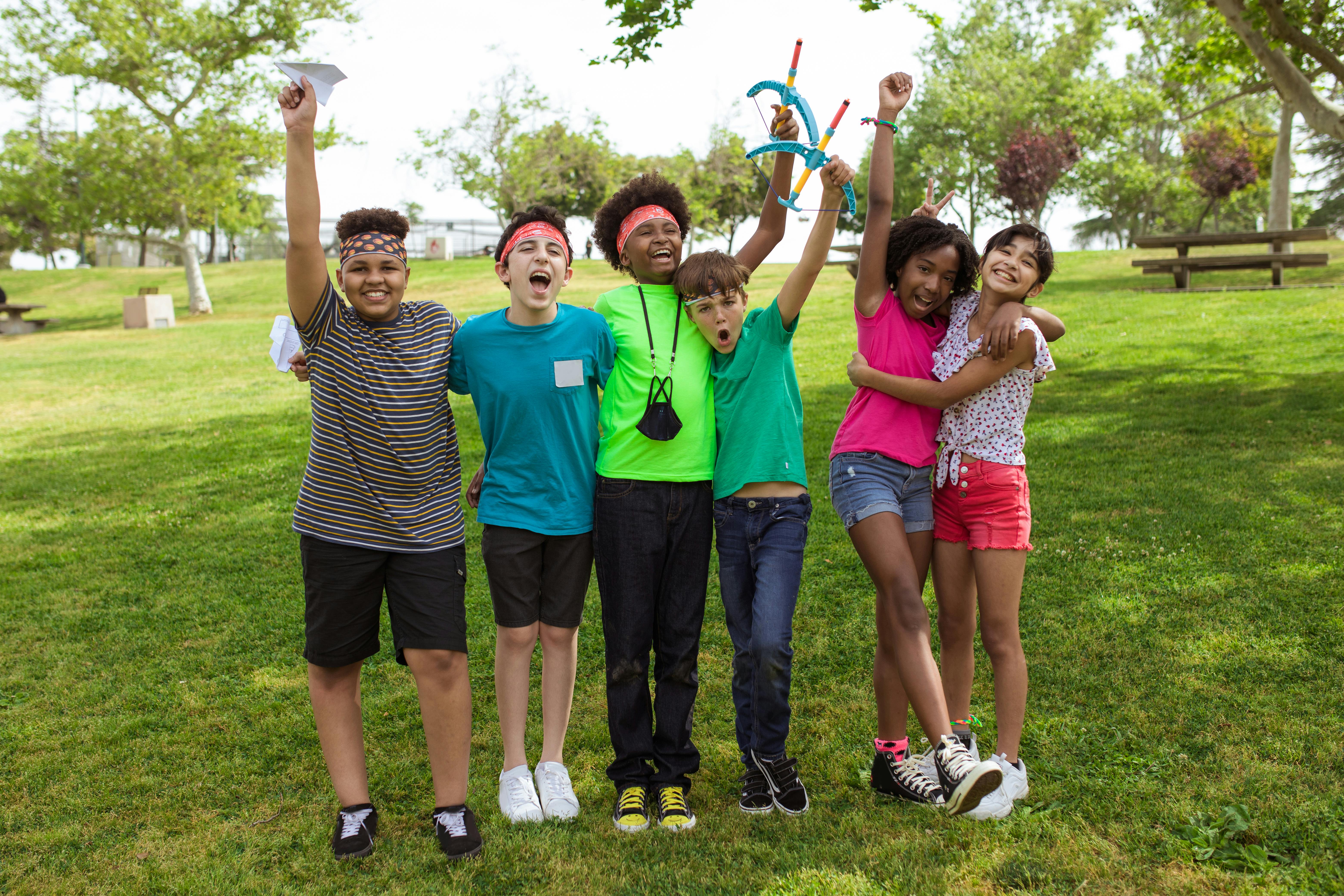 Kids celebrating in a park